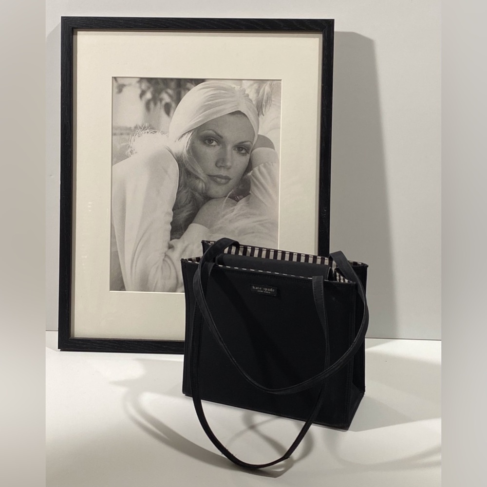 Very special black purse with black and white striped interior